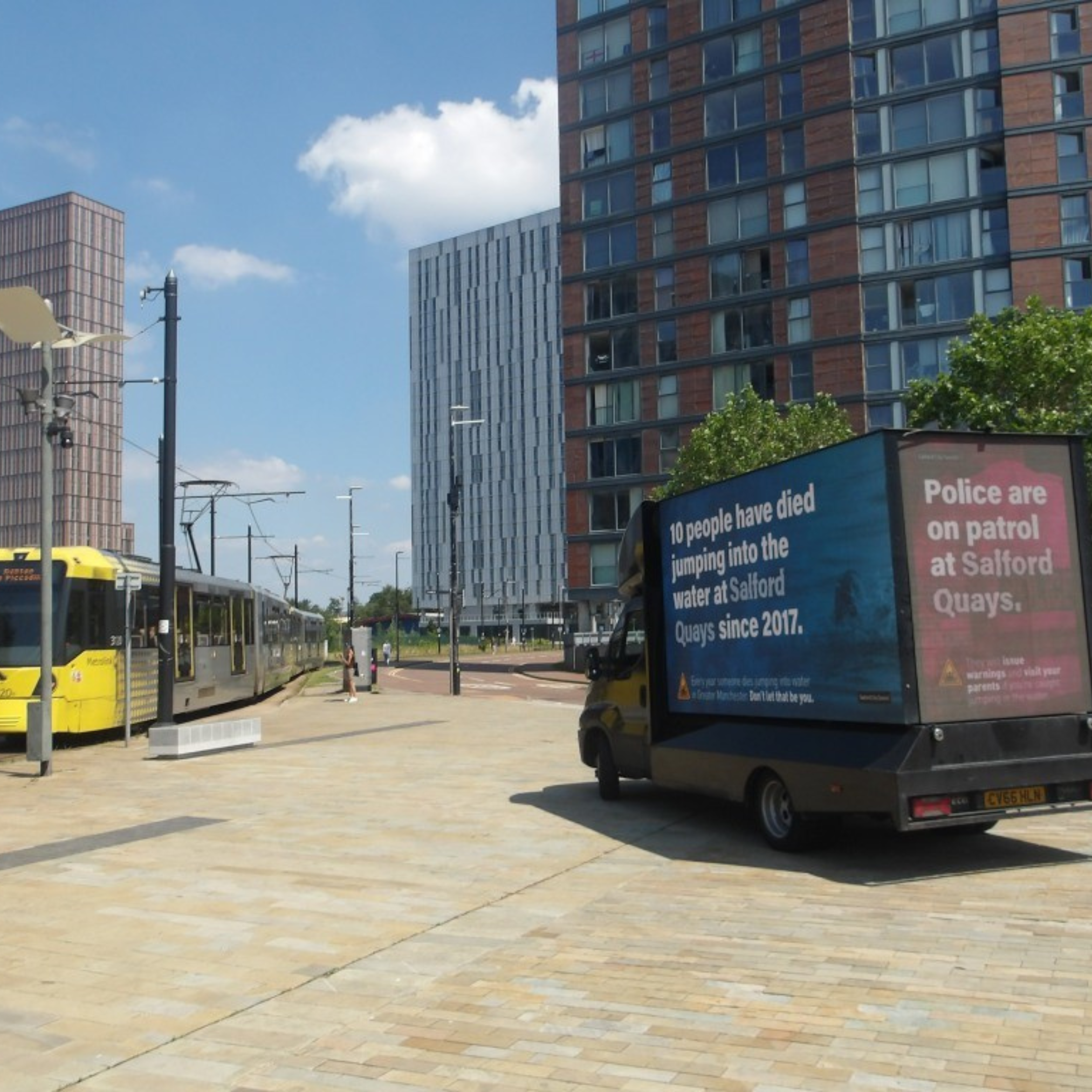 Buy Me Media mobile advertising van displaying a Salford City Council water safety campaign near MediaCity and Salford Quays in Greater Manchester.